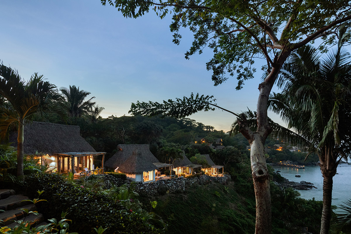 MAIN OFFICE adds half-circle yoga platform to thatched-roof guest villas in Sayulita, Mexico