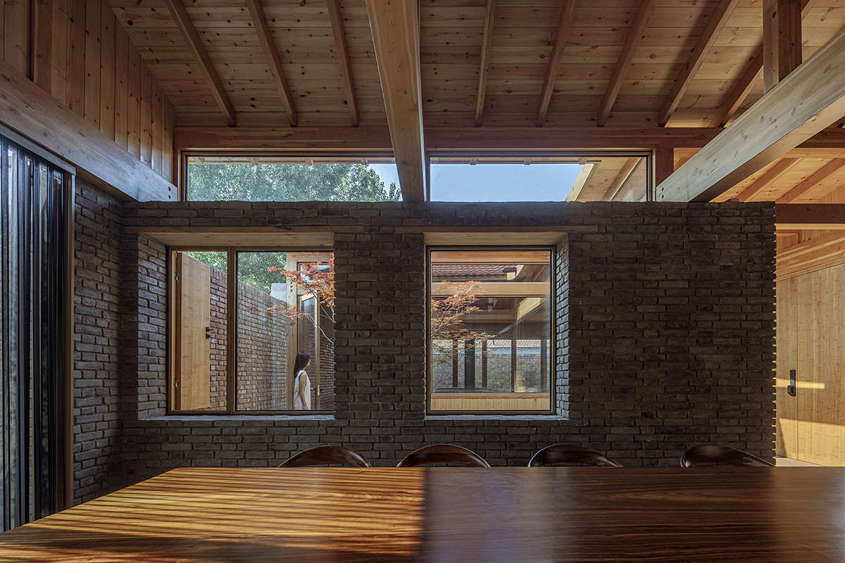 Archstudio renovates Beijing's old courtyard house with new wooden additions 