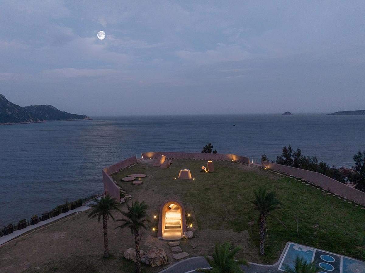 A gallery on a cliff features irregularly shaped lighting tubes that mimic marine creatures in China