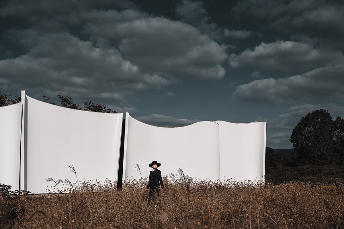 Chinese chapel creates a fluid silhouette featuring curving walls to mimic blossoming petals 