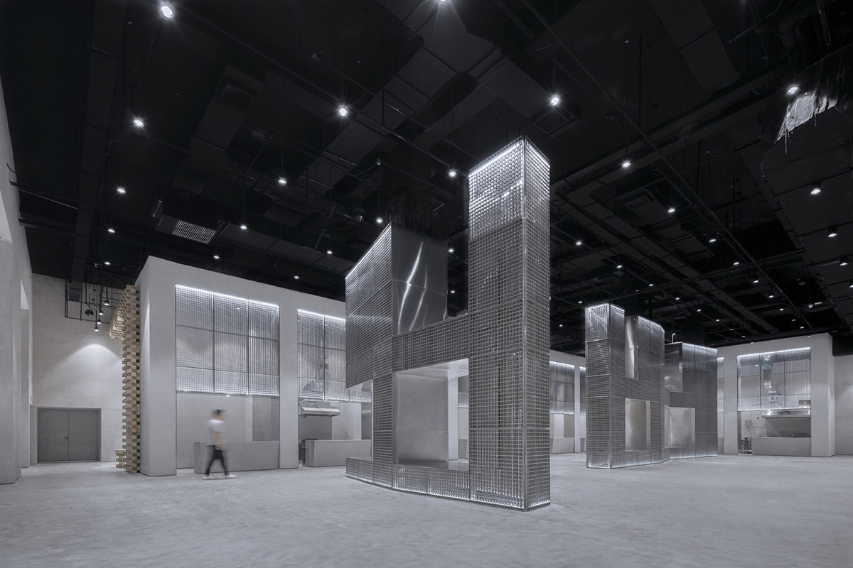 BANDe Architects combines greyscale interior with gridded wooden structures for GreenMonster Lab