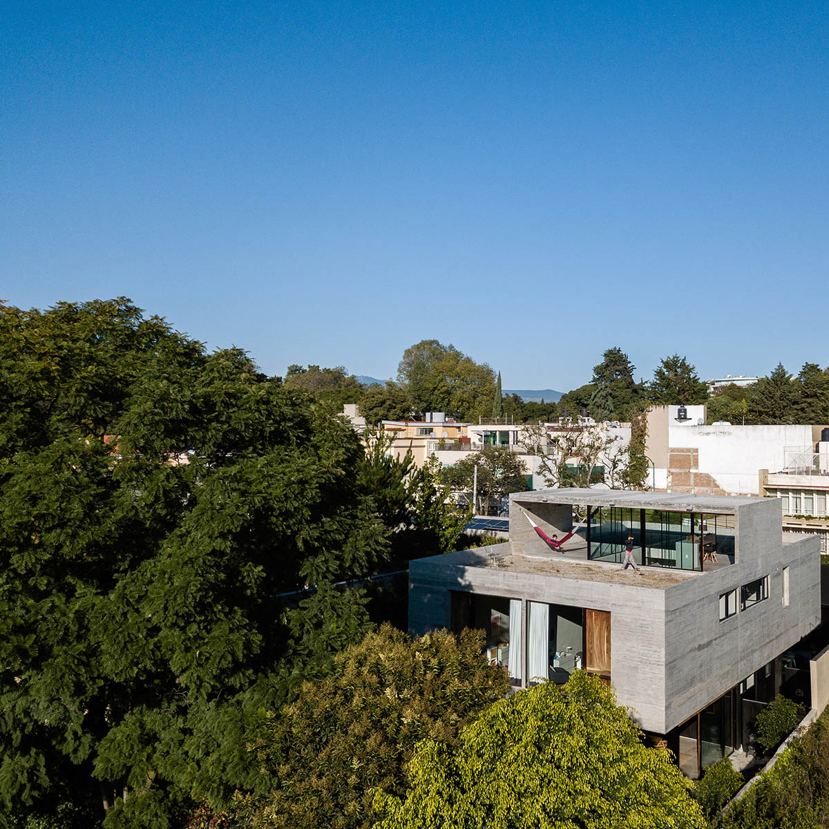 PPAA Arquitectos built compact concrete house with large private terrace in Mexico City