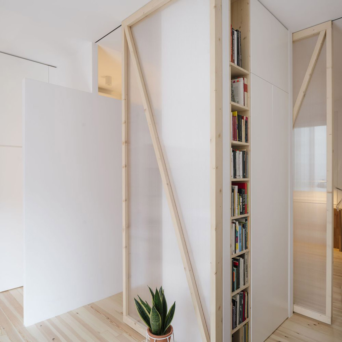 P+S Estudio de Arquitectura renovates Madrid's old apartment with moveable polycarbonate walls 