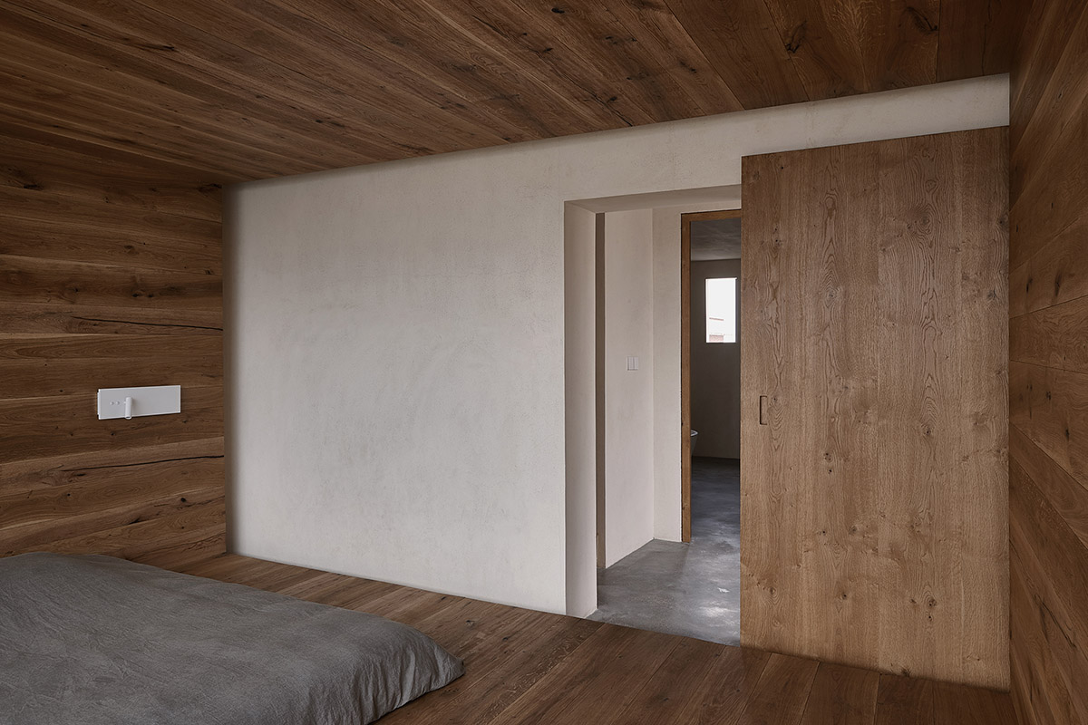 ZMY Design creates earth-toned interiors for a woodwork enthusiast’s house in Fujian, China