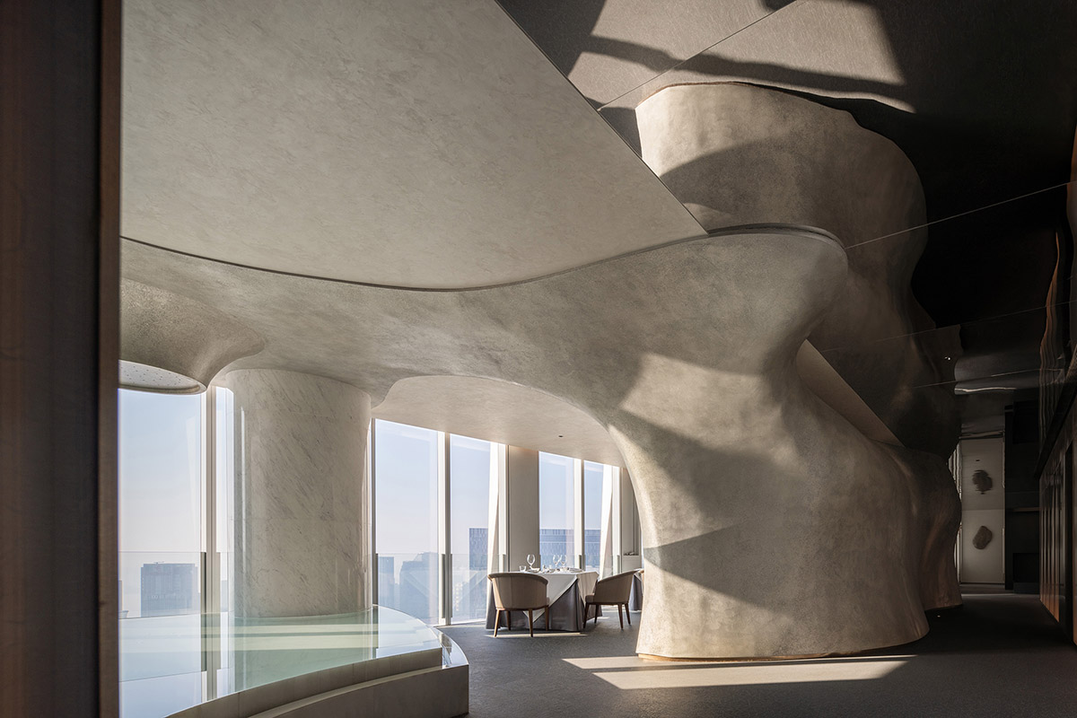 Nature Times Art Design completes restaurant with cave-like wall and garden-themed hall in Hangzhou