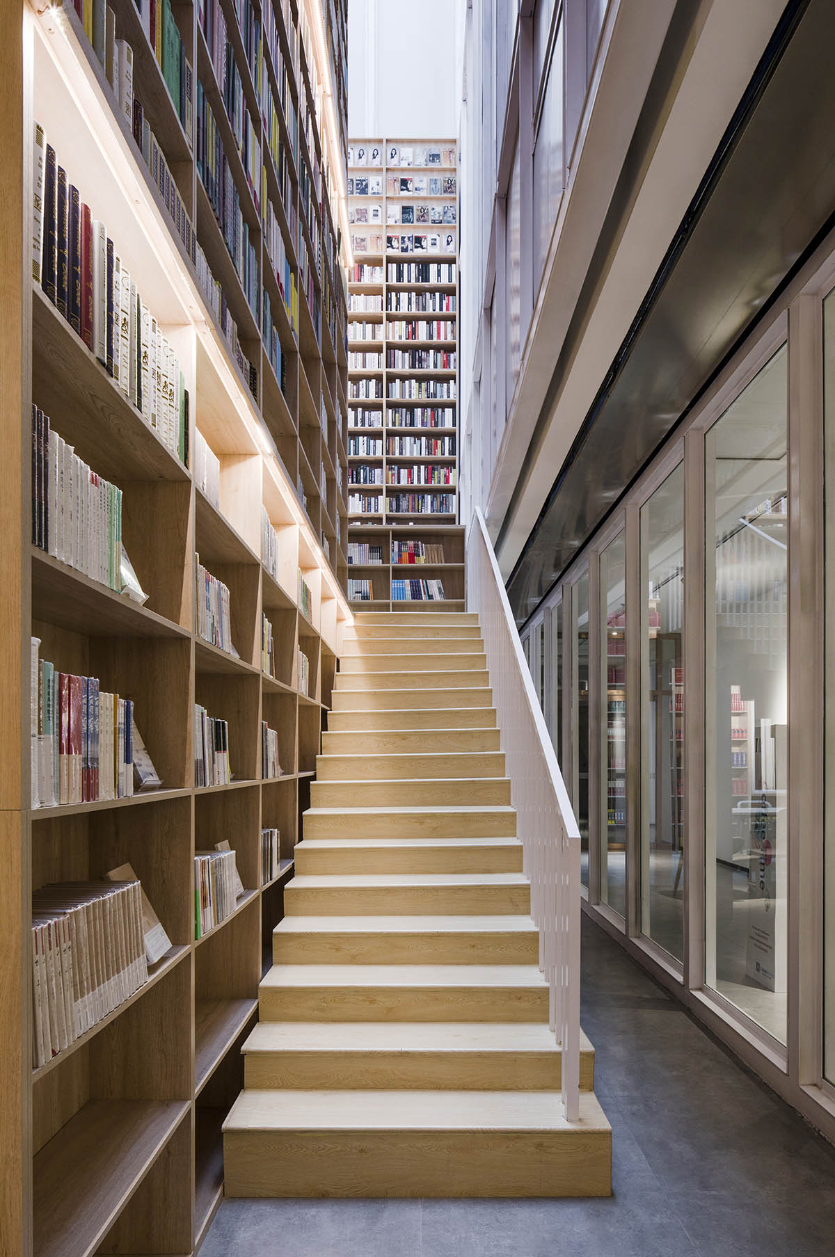 y.ad studio designs Yuanping Meijing Bookstore hidden in daylighting atriums in China