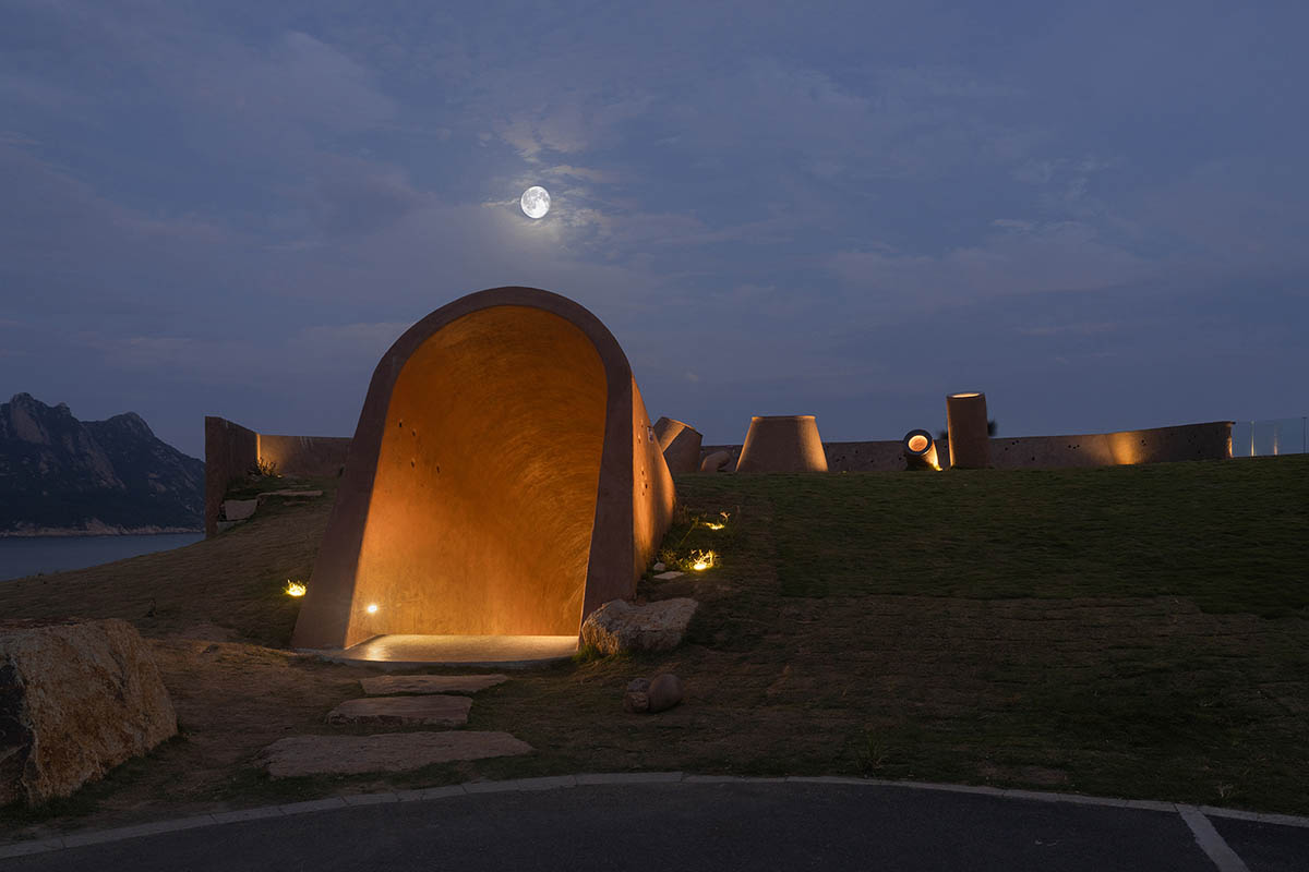 A gallery on a cliff features irregularly shaped lighting tubes that mimic marine creatures in China