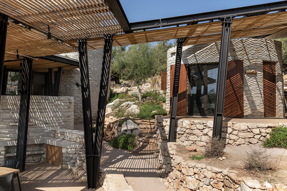 Pastoral round stone dwellings inform Meganisi House by Hiboux Architecture on Meganisi island