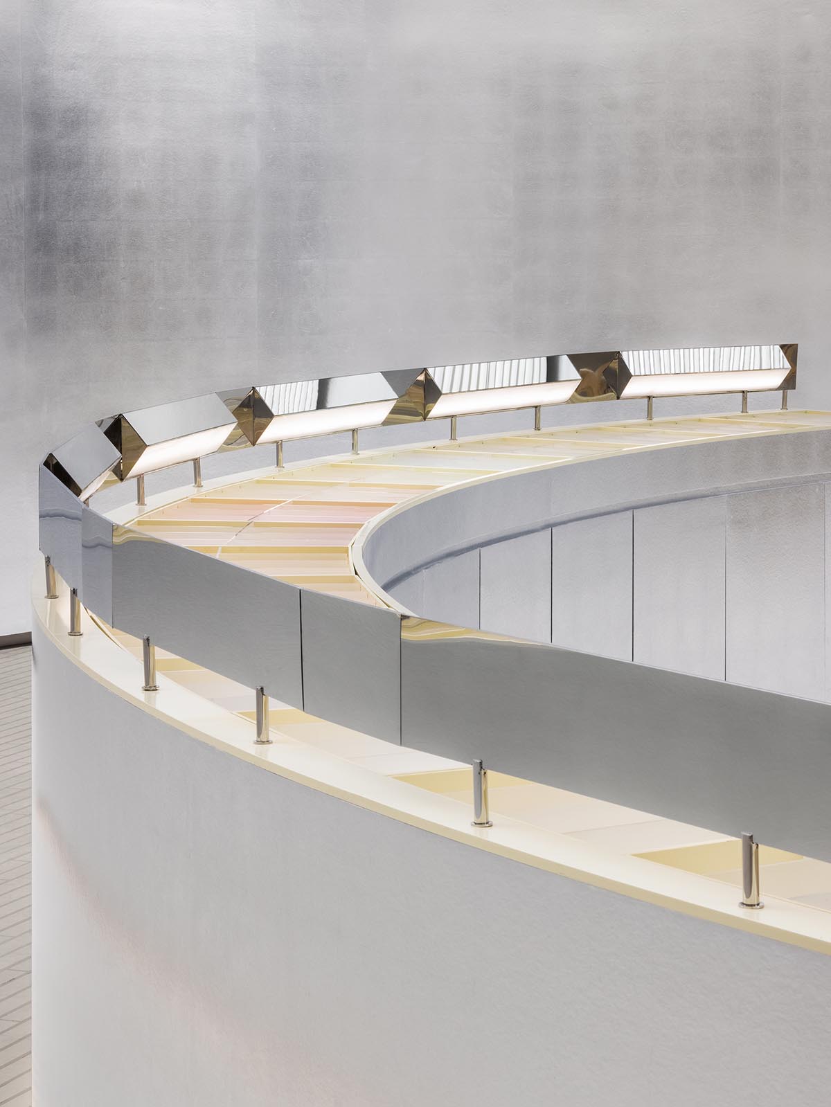 Various Associates designs beauty store with winding staircase and silver-toned interiors in Hangzhou