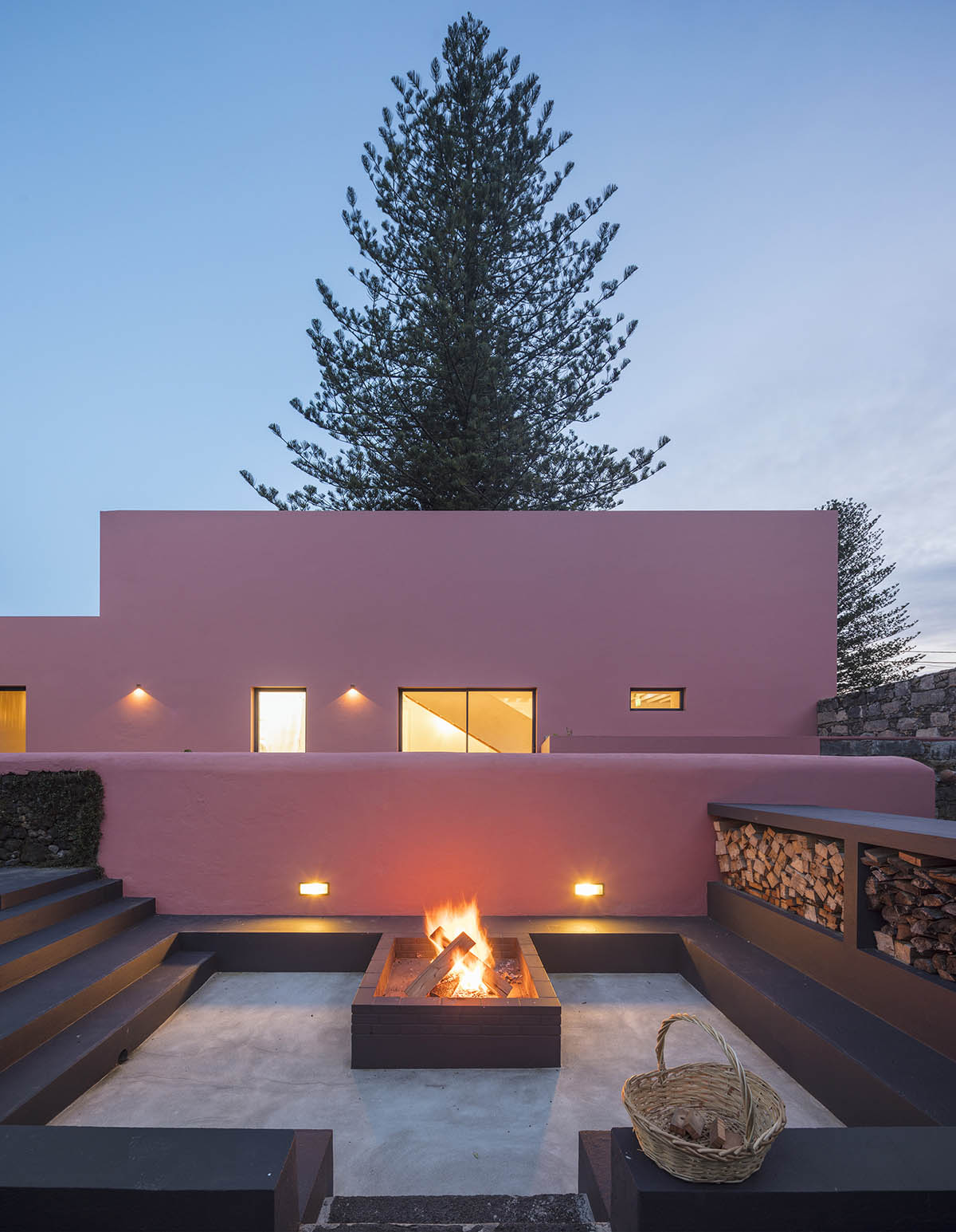 Mezzo Atelier transforms old barn into guesthouses featuring different hues of pink