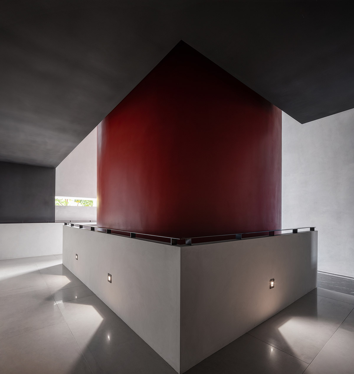 Masanori Designs' interiors include red cylinder bringing rainwater into the space