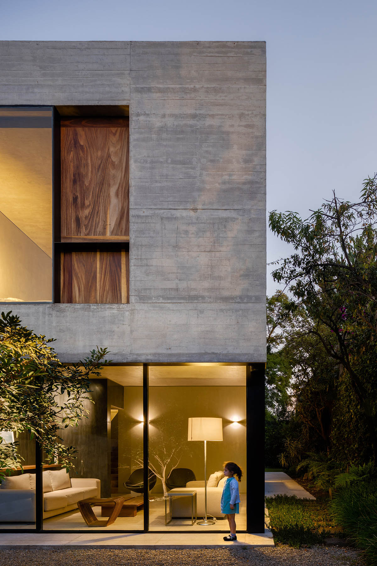 PPAA Arquitectos built compact concrete house with large private ...