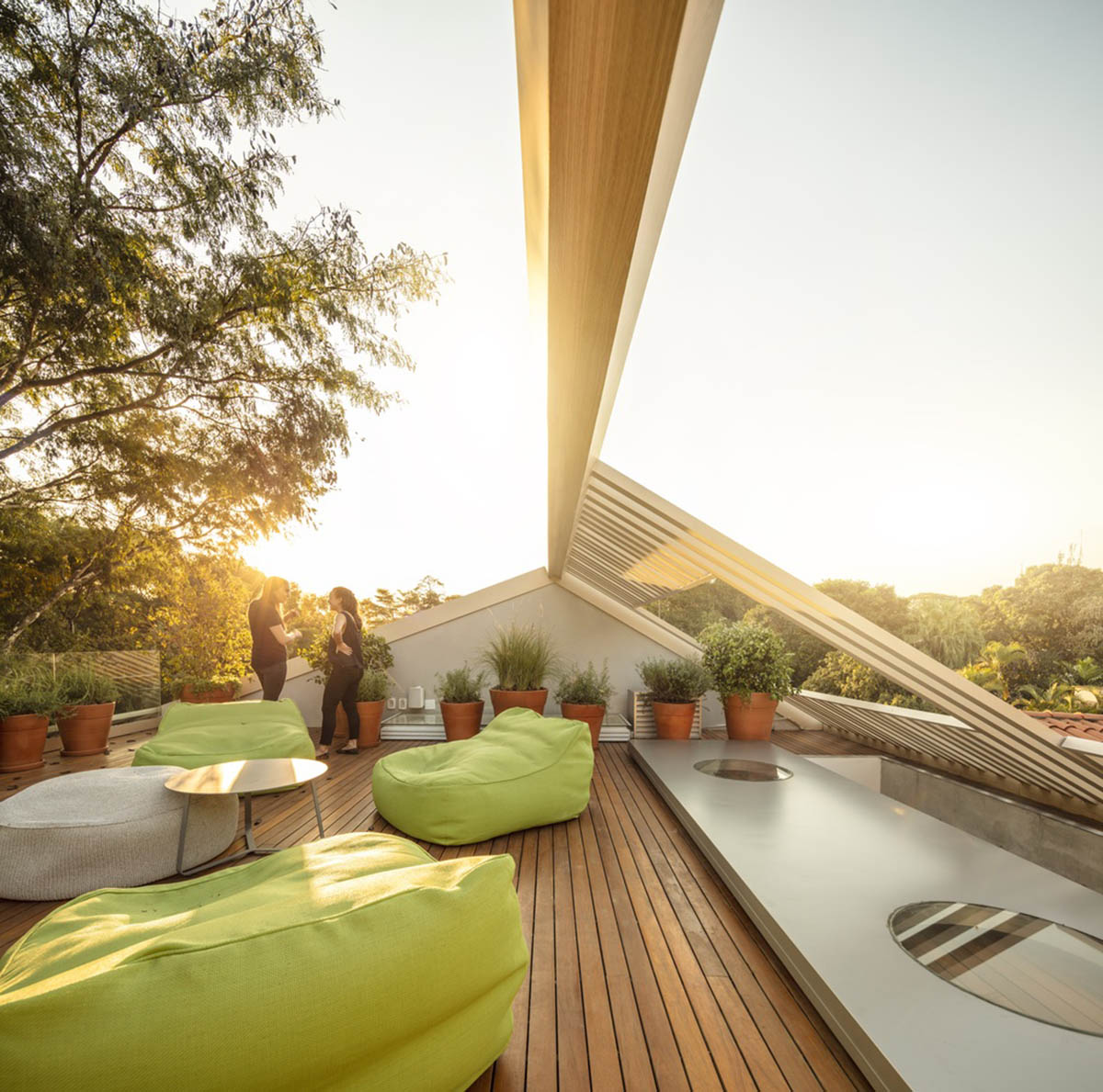 Studio AG designed large wooden residence featuring punctured volumes with gabled roof in São Paulo