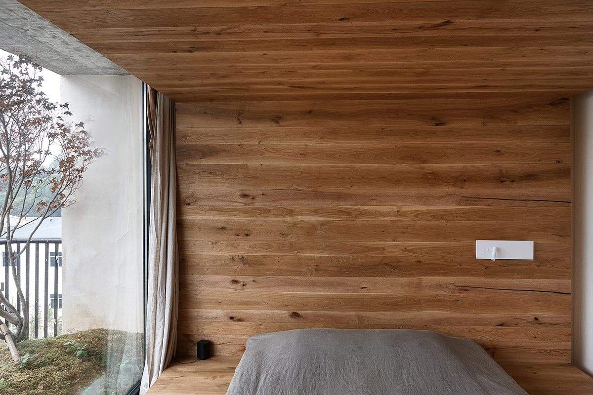 ZMY Design creates earth-toned interiors for a woodwork enthusiast’s house in Fujian, China