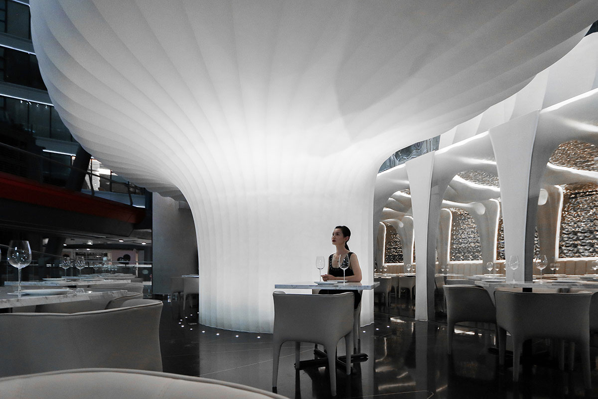 CAA Architects creates flower-like double-deck terrace in the interior of restaurant in Beijing