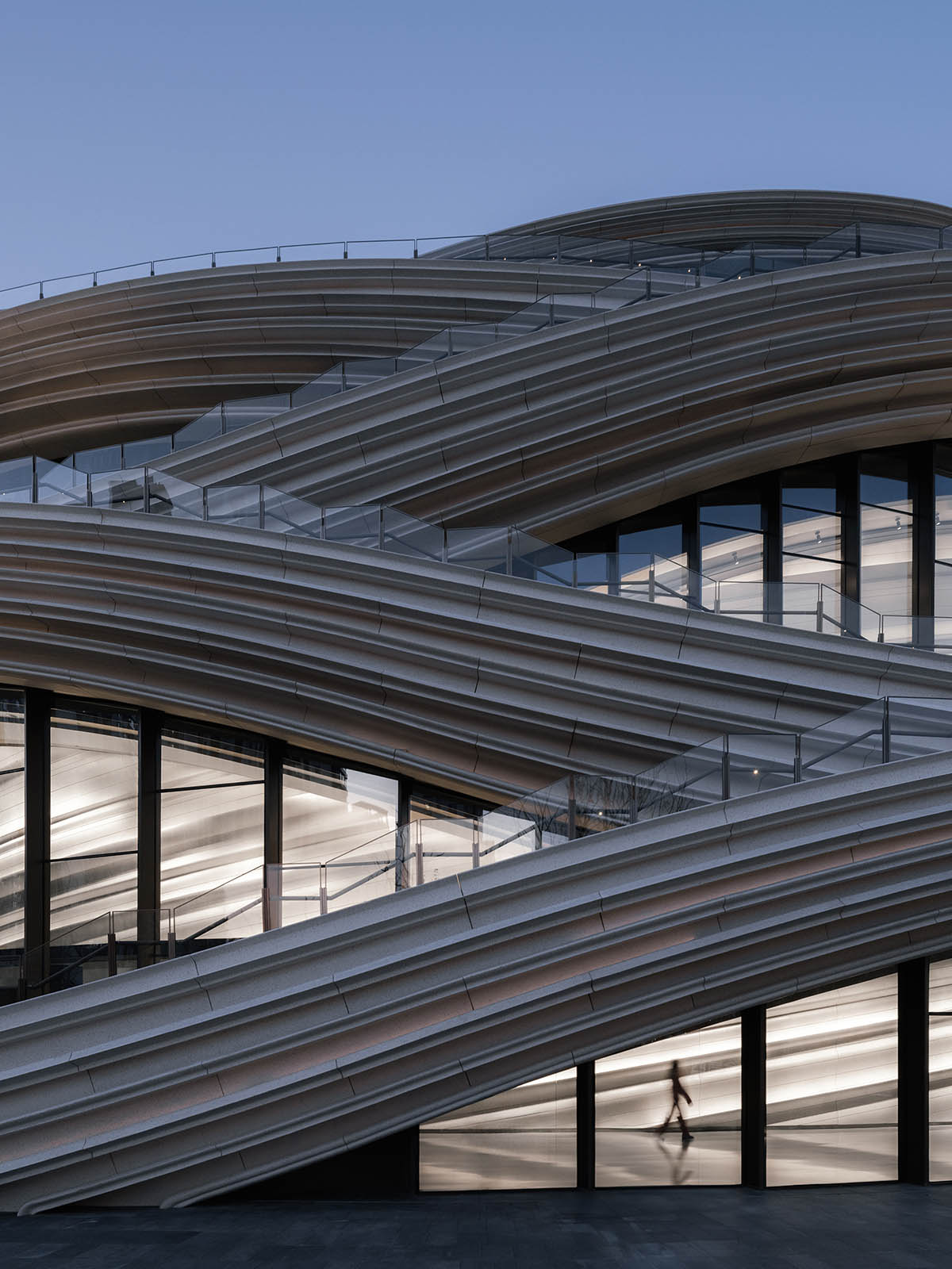 Undulating lines and expansive waves define interior of Orbit public exhibition hall in Shanghai 