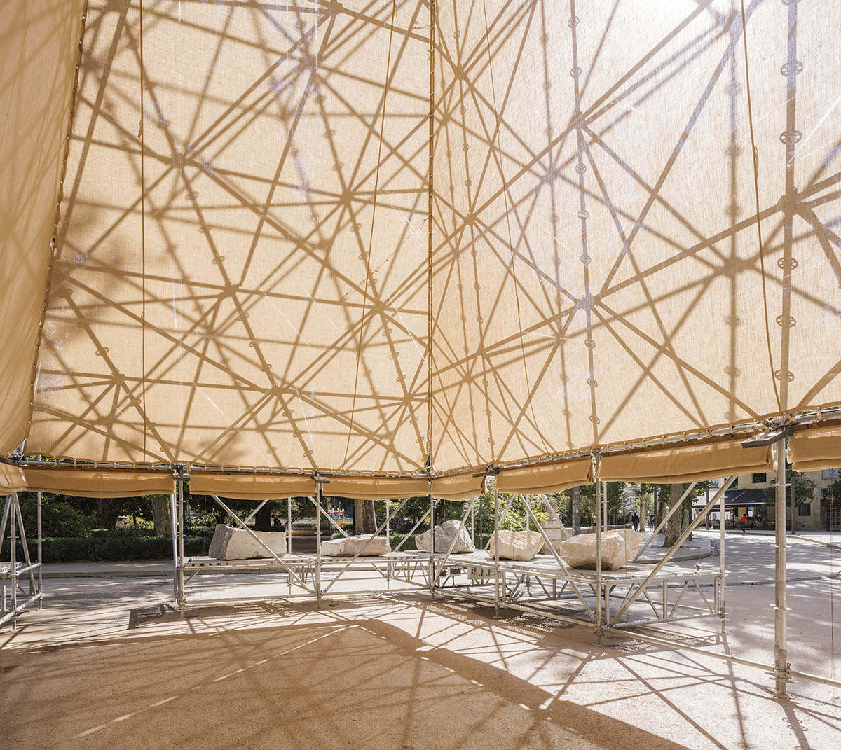Aire Pavilion wrapped by giant scaffolding represents 