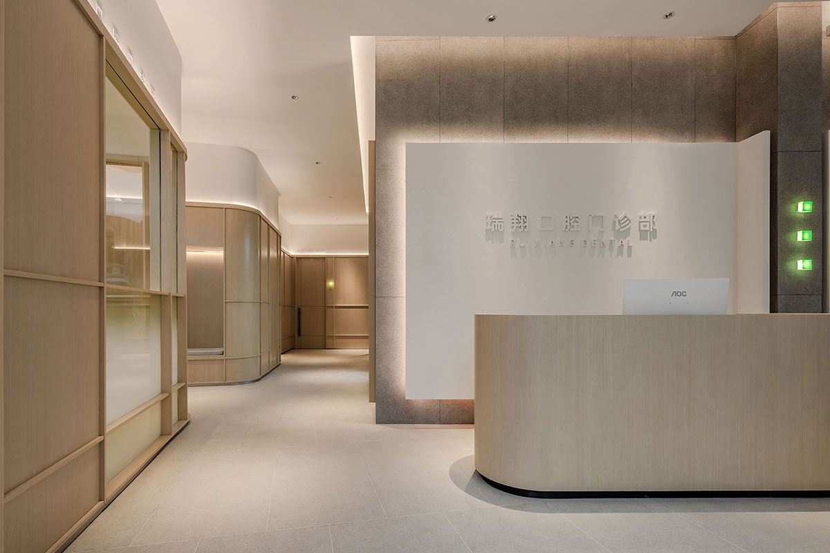 JACKY.W DESIGN completes dental clinic with rounded wooden walls and natural tones in China 