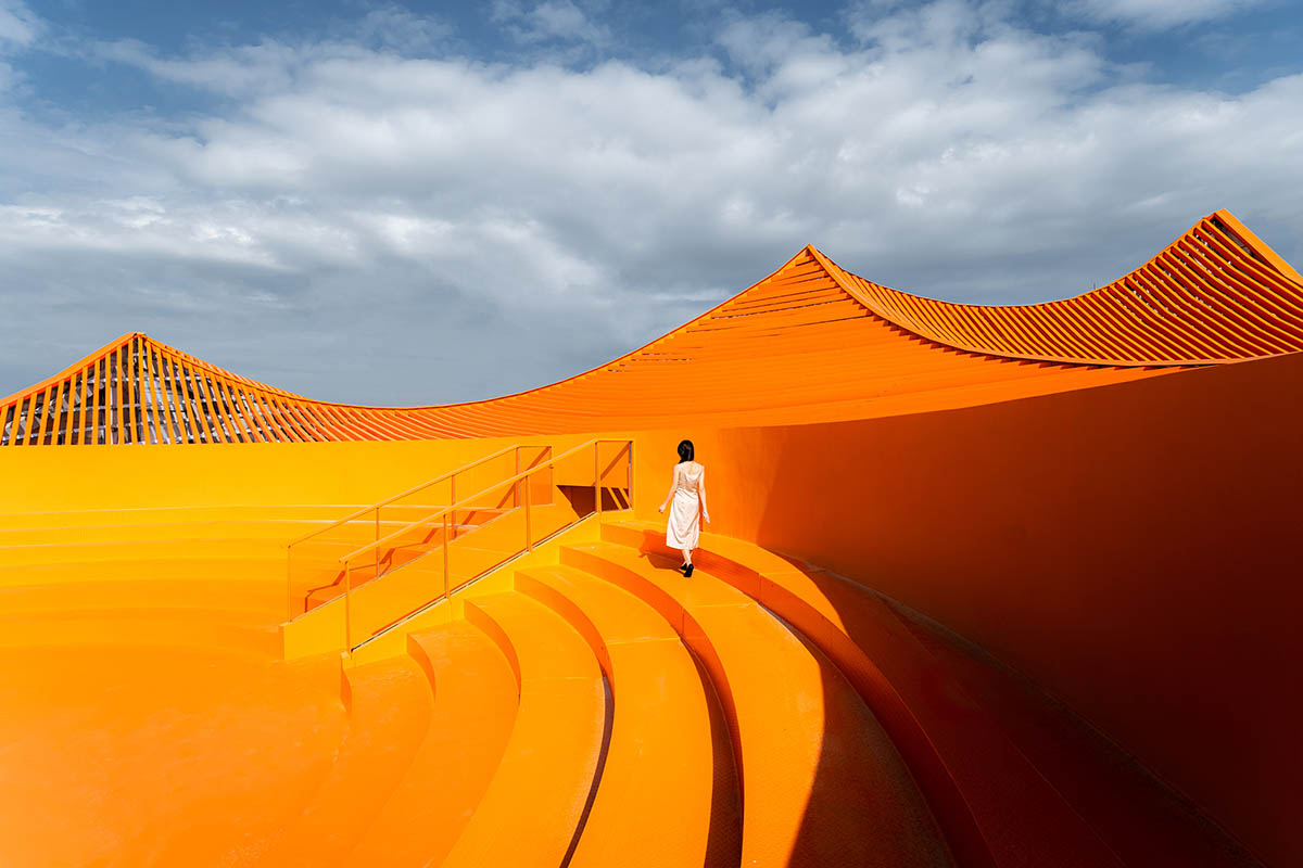 Wutopia Lab built showroom evoking Chinese red mountains with dazzling orange-colored roof