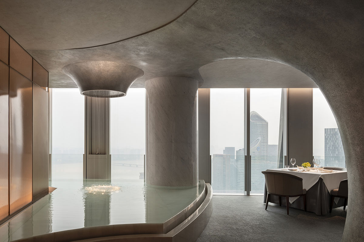 Nature Times Art Design completes restaurant with cave-like wall and garden-themed hall in Hangzhou