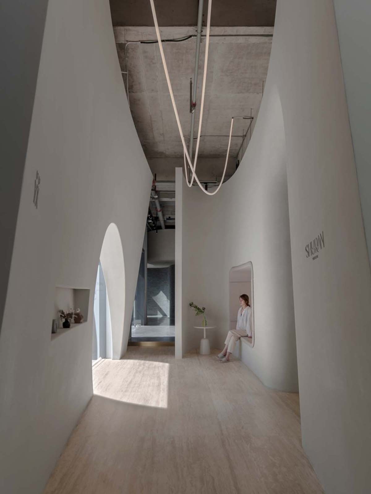 Smooth corners and rounded walls form cave-like wellness center designed by E Studio in China