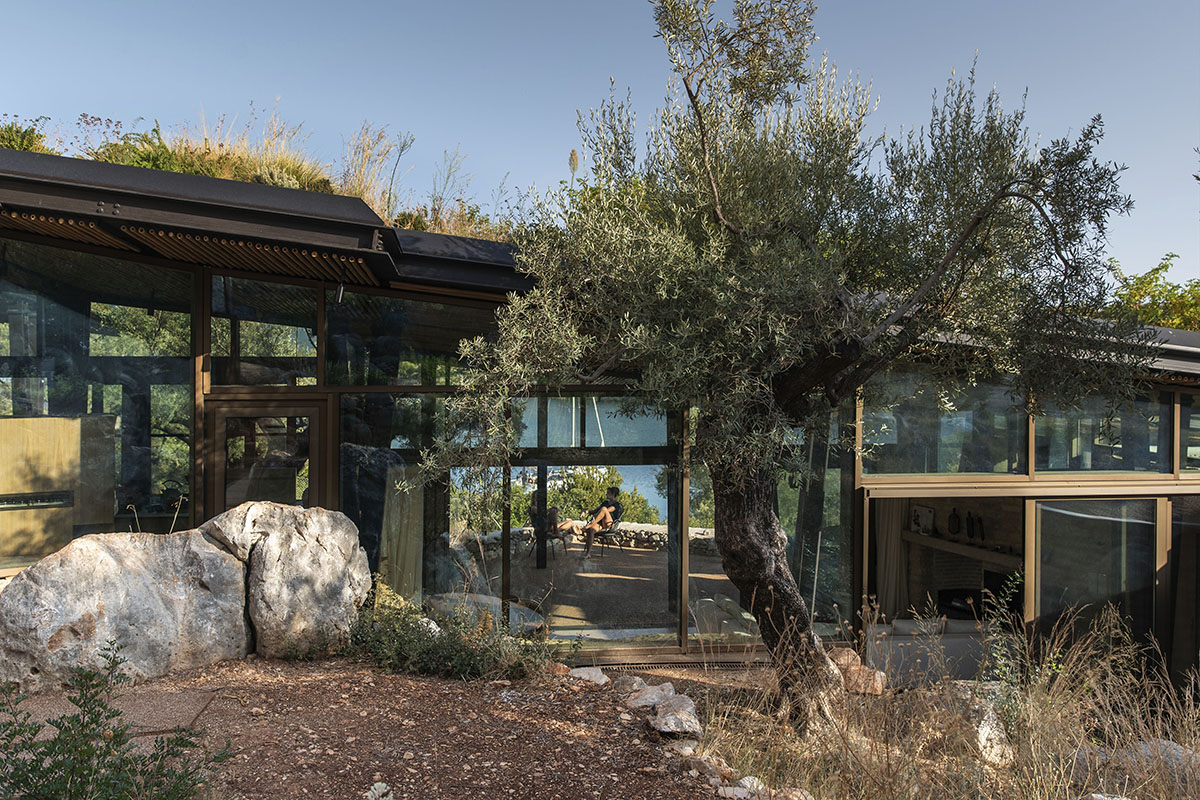 Pastoral round stone dwellings inform Meganisi House by Hiboux Architecture on Meganisi island