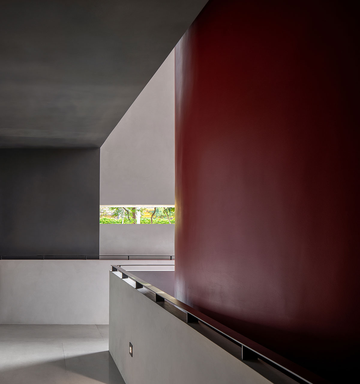 Masanori Designs' interiors include red cylinder bringing rainwater into the space