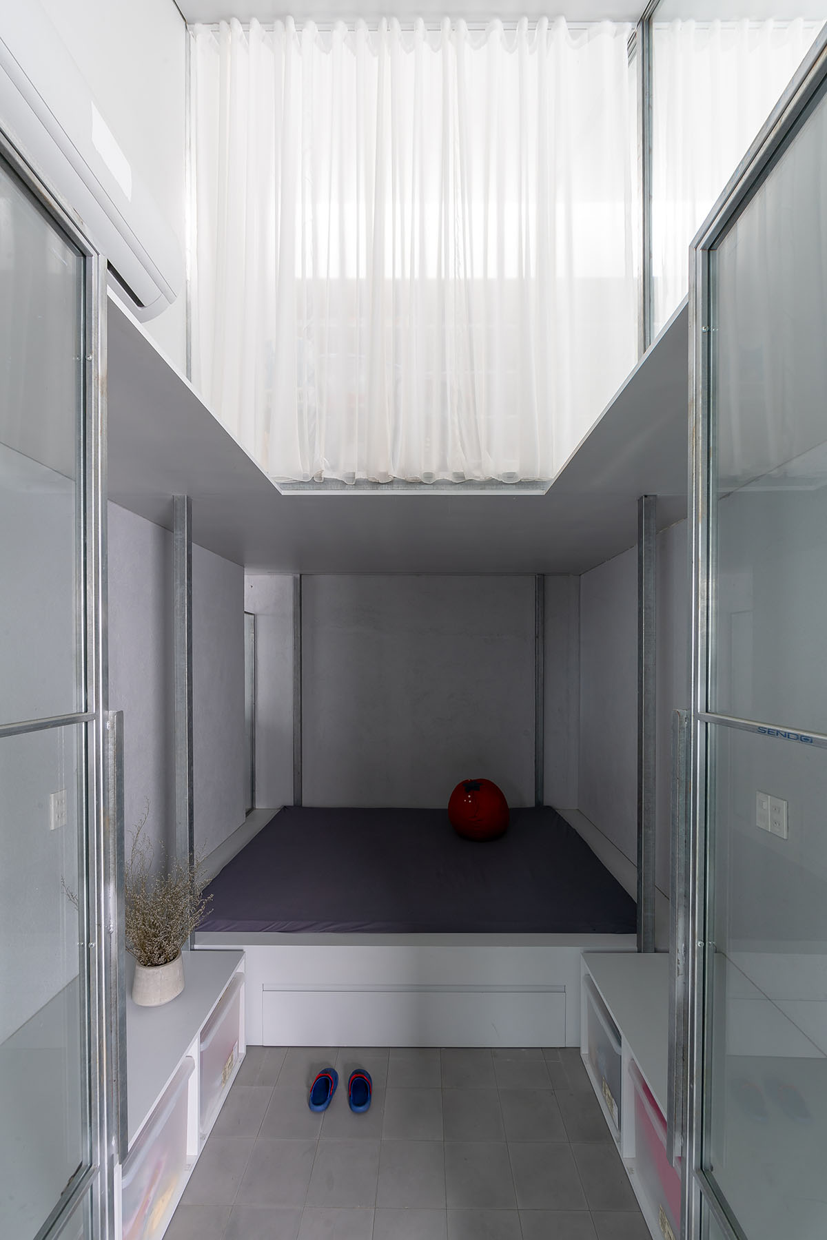 MIA Design Studio completes family house with angular roof in Vietnam 