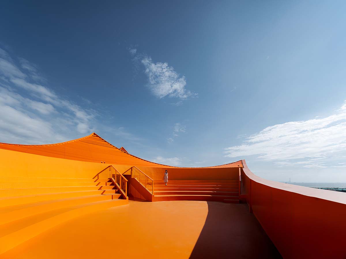 Wutopia Lab built showroom evoking Chinese red mountains with dazzling orange-colored roof
