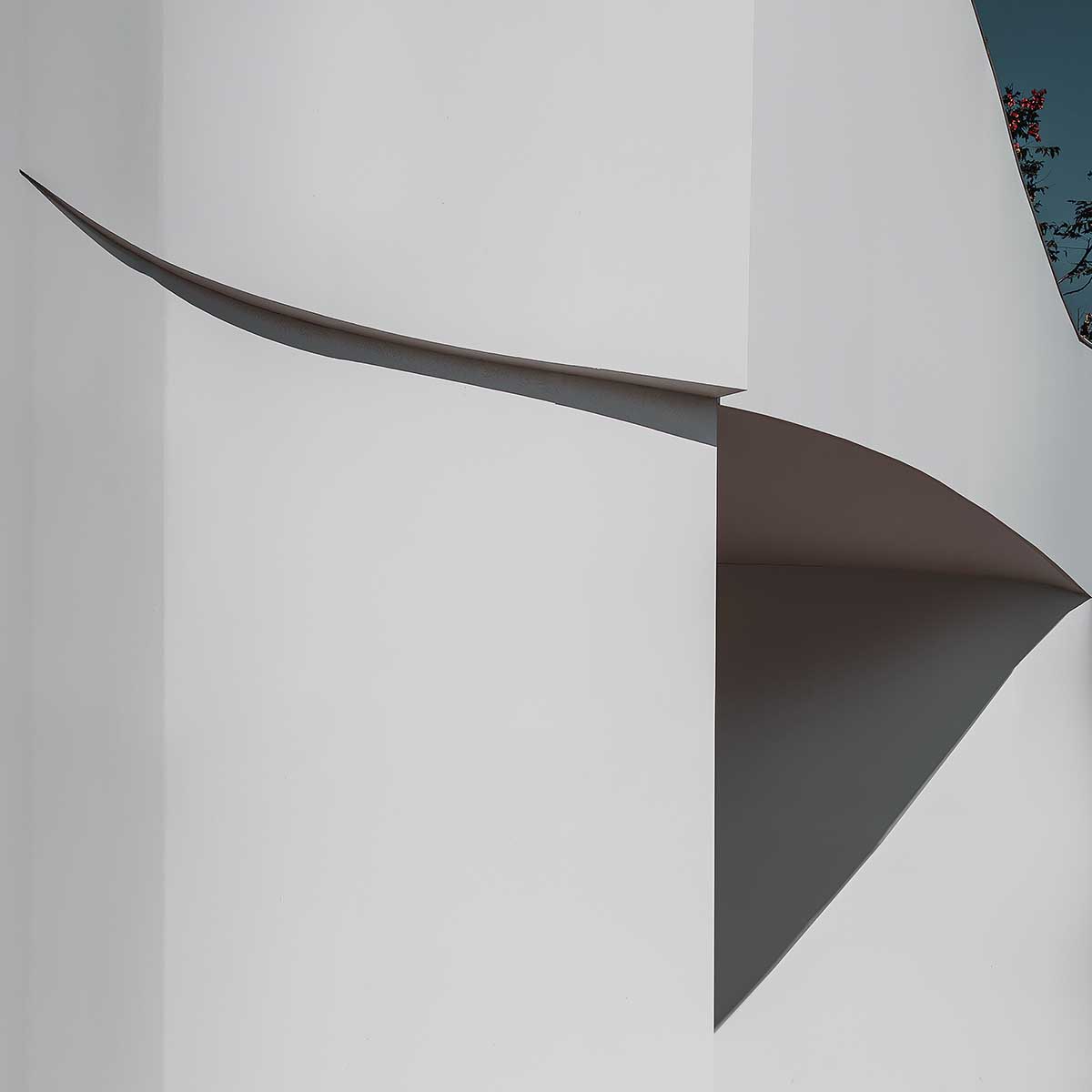 Chinese chapel creates a fluid silhouette featuring curving walls to mimic blossoming petals 