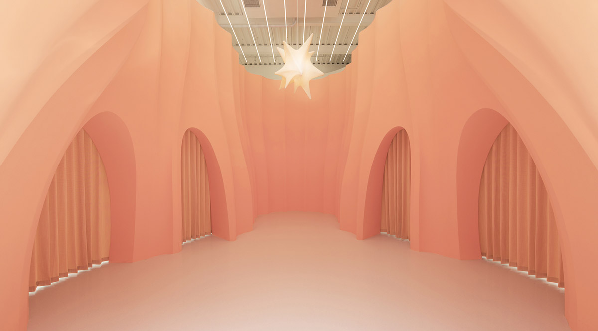 123 architects converts industrial building into photography studio featuring arched addition
