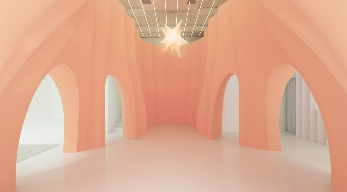 123 architects converts industrial building into photography studio featuring arched addition