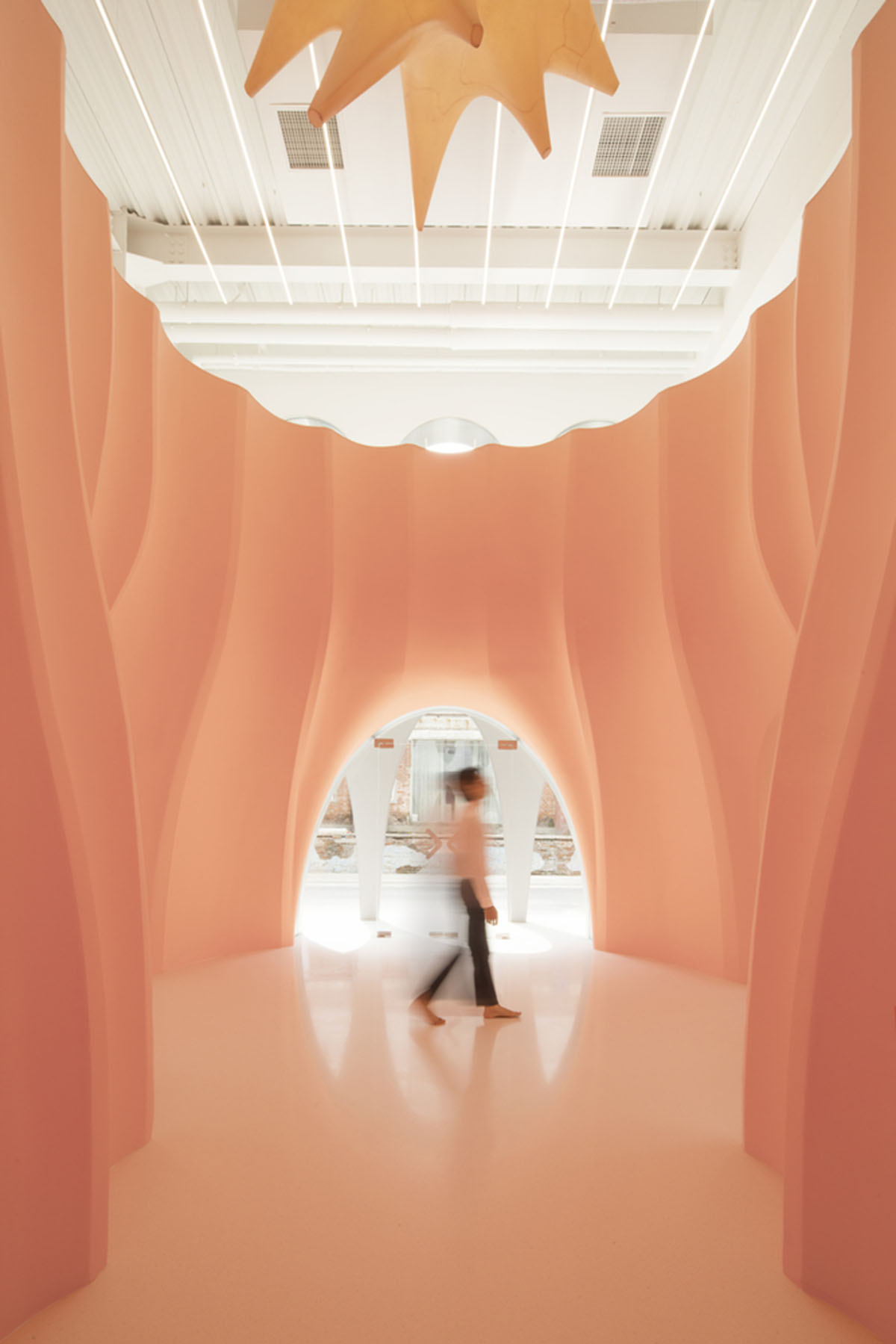 123 architects converts industrial building into photography studio featuring arched addition