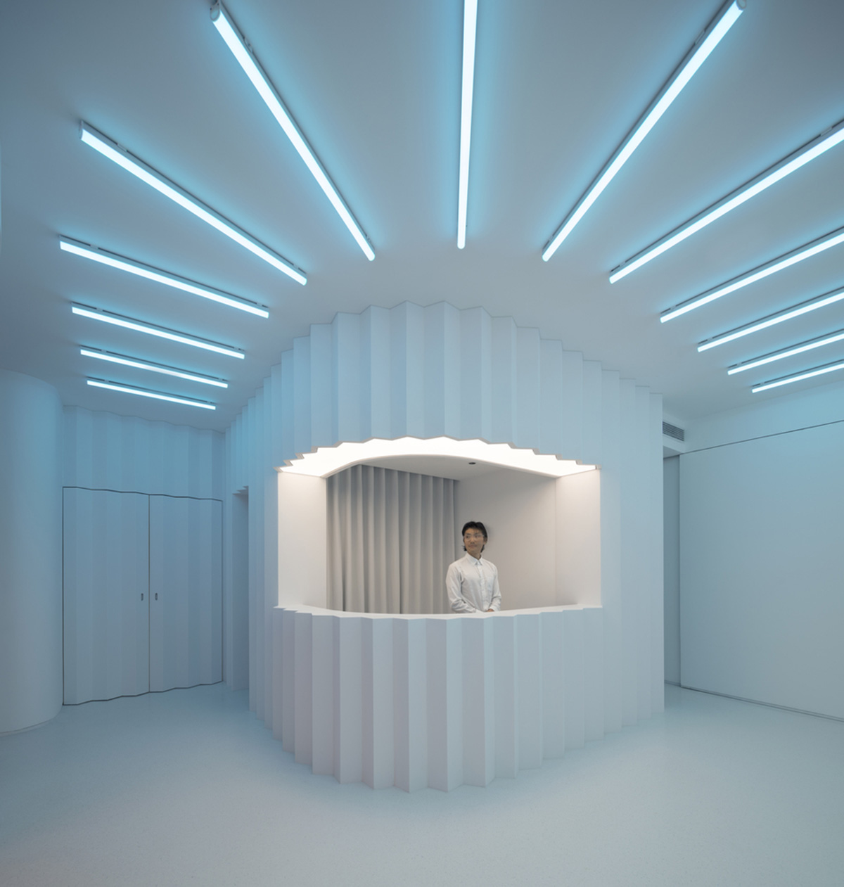 123 architects converts industrial building into photography studio featuring arched addition