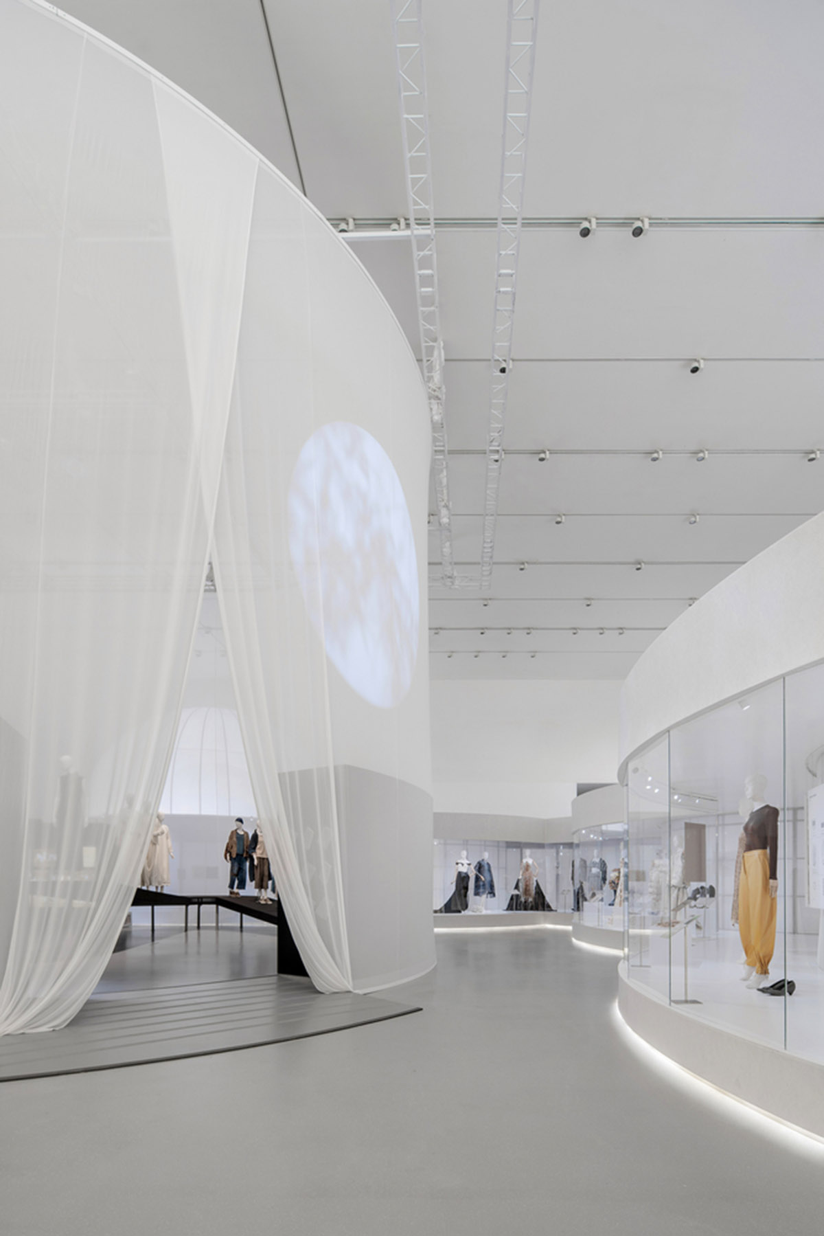 Studio 10 designs exhibition space with white tubular structures and black translucent ramps in China