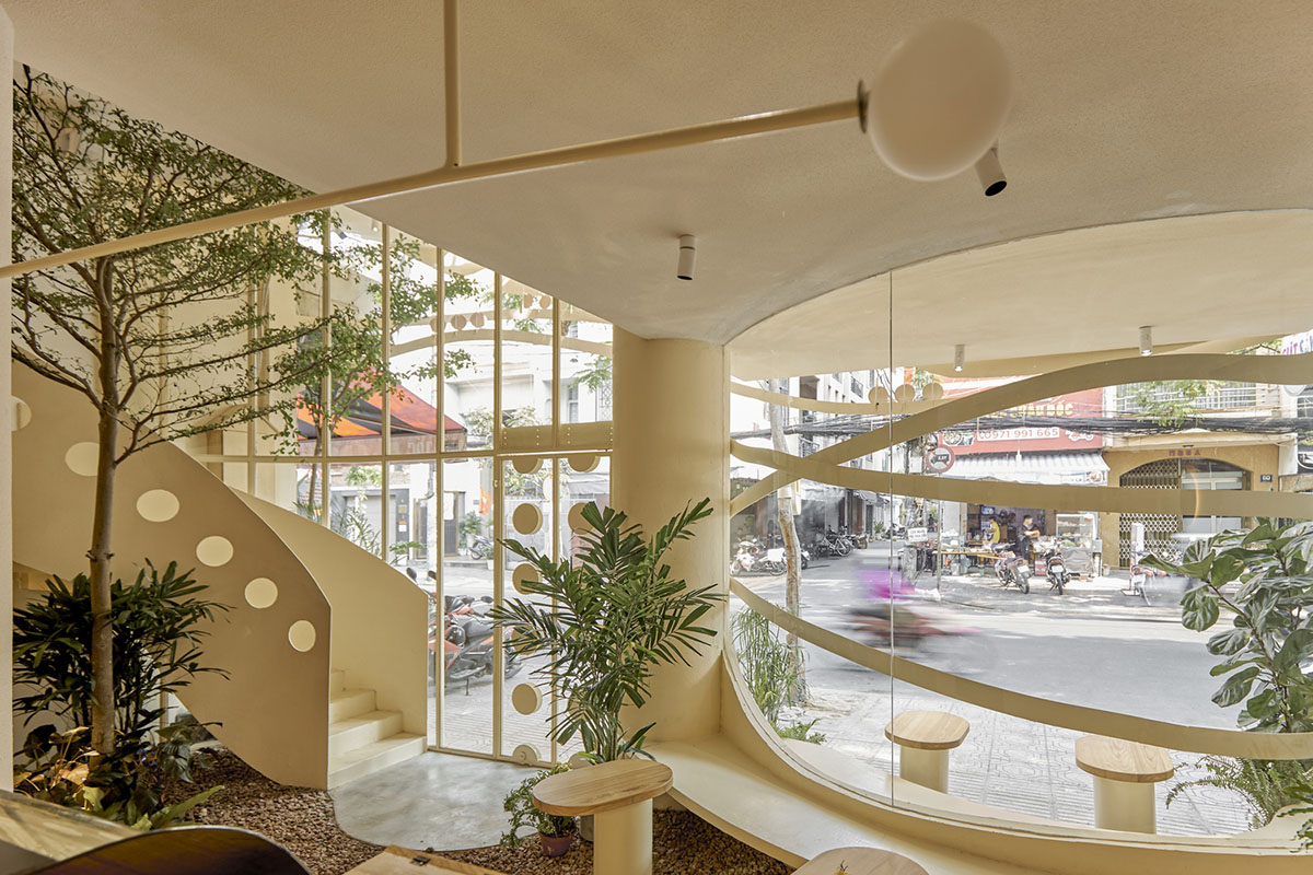 September Cafe is designed to look like a bird's nest with curved steel stripes in Vietnam