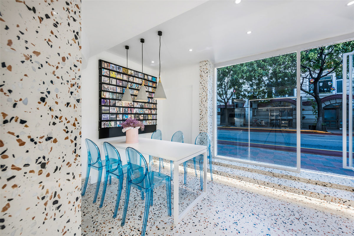 This tiny cafe by TOUCH Design is dotted with white and orange interwoven terrazzo details in Tianjin