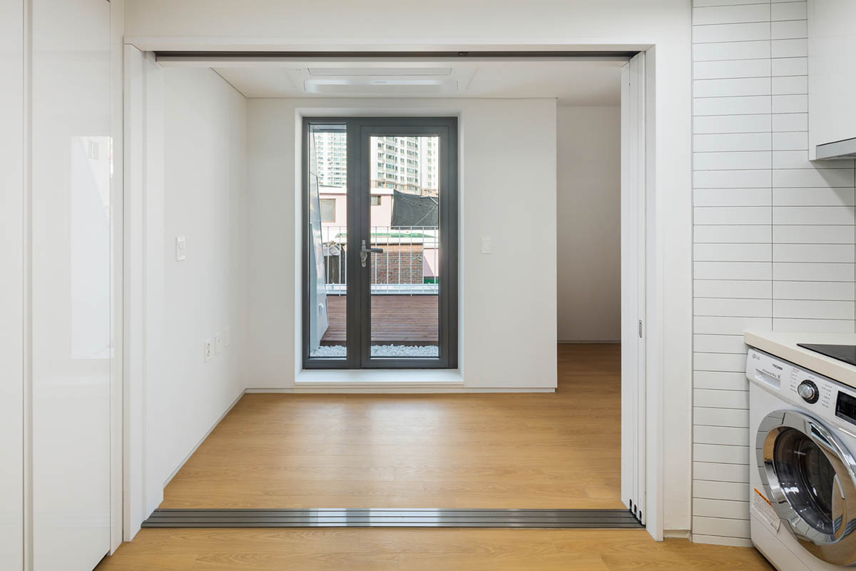 2m2 architects designed clay brick Sista House with inclined roof on narrow lot in Seoul