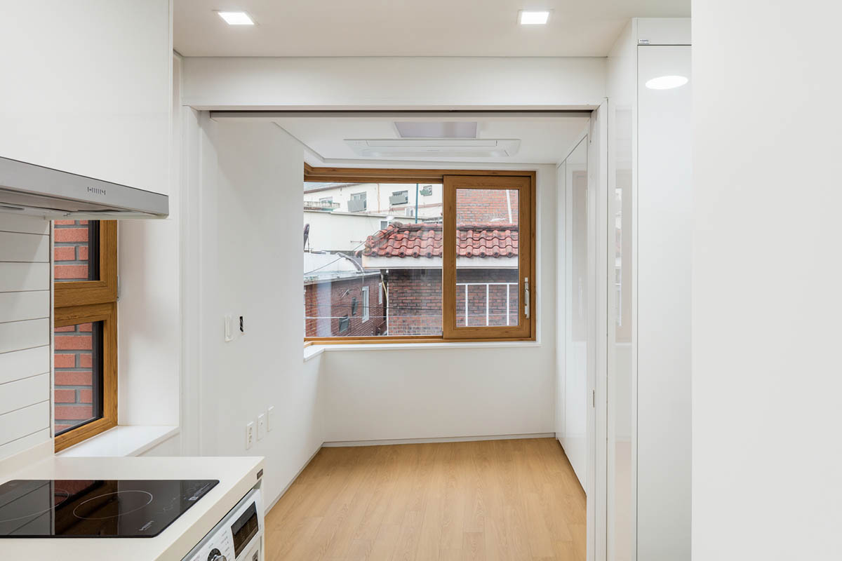 2m2 architects designed clay brick Sista House with inclined roof on narrow lot in Seoul