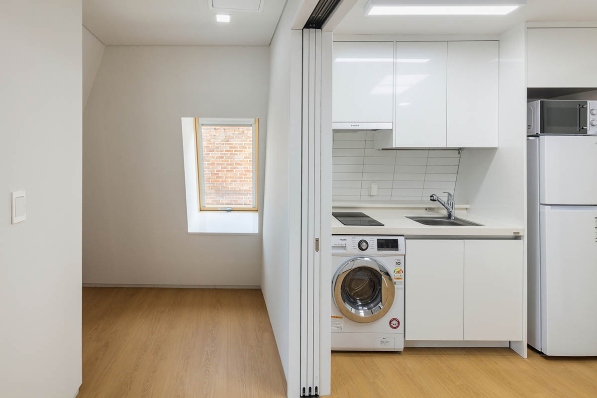 2m2 architects designed clay brick Sista House with inclined roof on narrow lot in Seoul
