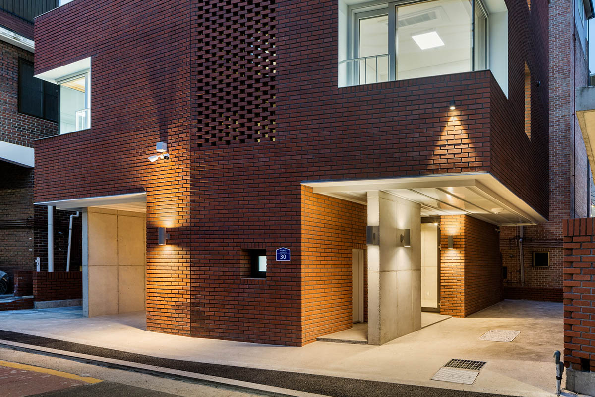 2m2 architects designed clay brick Sista House with inclined roof on narrow lot in Seoul