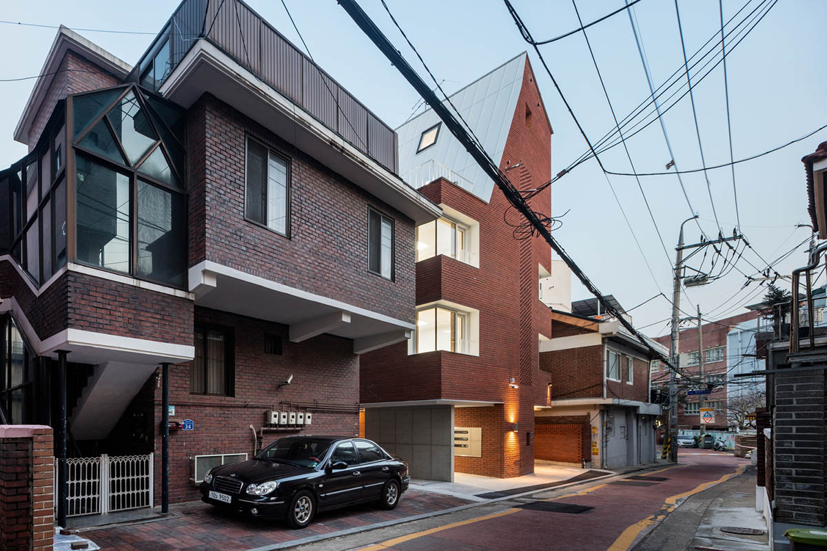 2m2 architects designed clay brick Sista House with inclined roof on narrow lot in Seoul