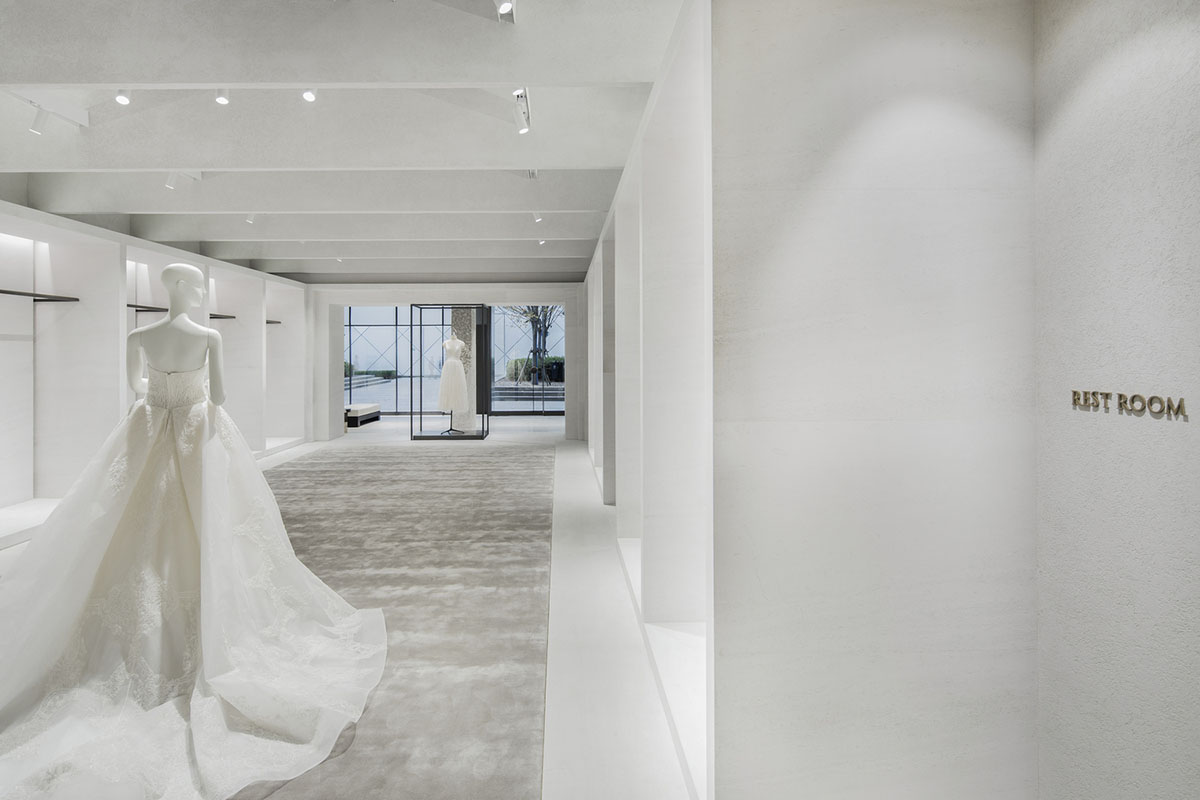 Atelier tao+c combines bright interior with black-framed showcase rooms for flagship store in China