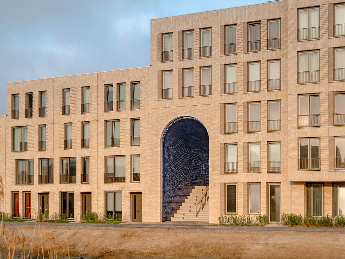 Studio RAP clads two gates of PoortMeesters residential building block in 3D blue porcelain