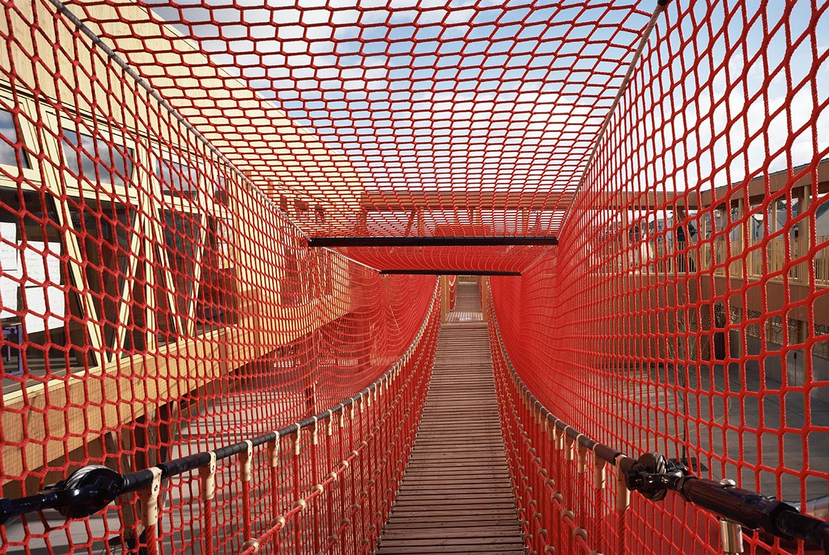 Wooden school by r2k architecte is inspired by Nordic architecture to be a positive energy building