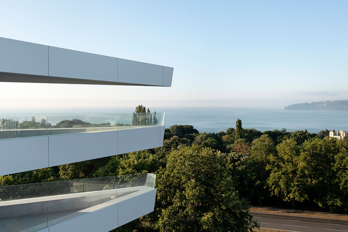 Sharp triangular balconies define this residential block designed by STARH in Bulgaria