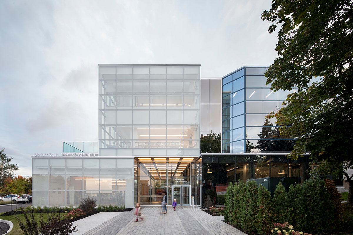 Whitish glass library designed by ACDF Architecture acts as a white floating volume in Quebec