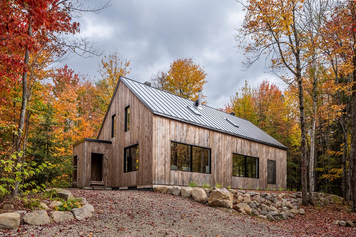 Country home is a wooden shelter that brings tranquility in the heart of the forest in Canada