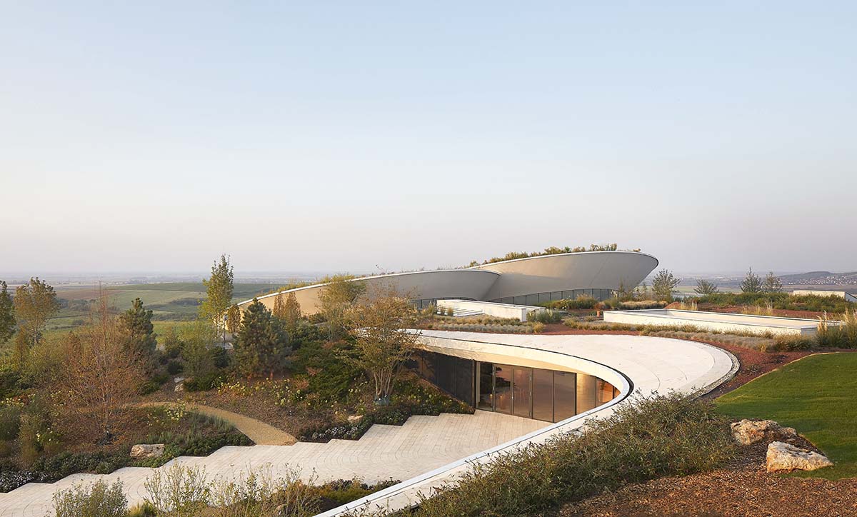 Two circular hovering volumes form a winery perched atop the Padi Hill in Hungary 