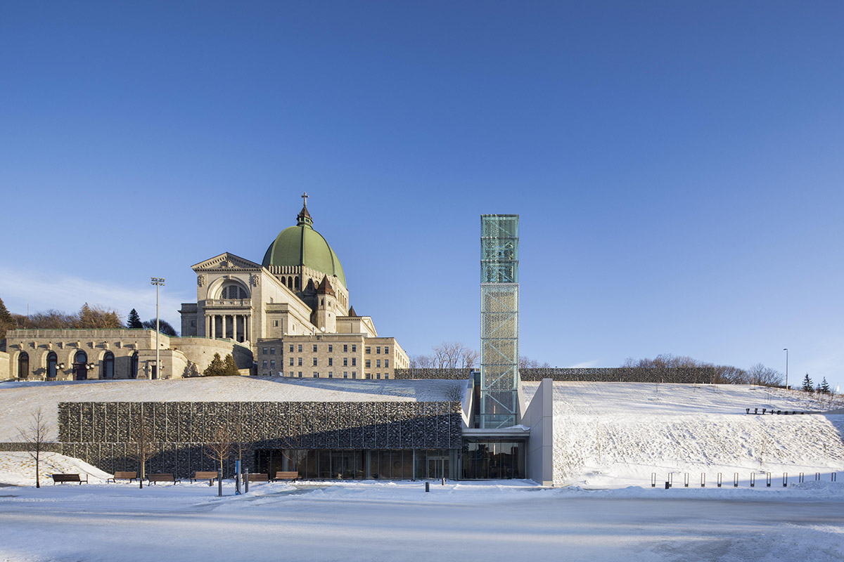 A striking bell tower pierces the sky, illuminating the grandeur of the pavilion in Montreal